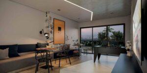 Salão de jogos do SmartHome com mesas para jogos diversos, TV, e mesa de pebolim